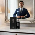 Malay man adjusting blazer with Afnan 9PM EDP perfume bottle men fragrance Malaysia