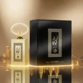Kayaan Gold floating on a mirror‑pool with golden glow and bergamot vapor ring; KL reflection; clear bottle and box.