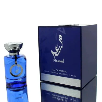 Perfume bottle with gold cap and black and red patterned label on a white background