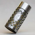 Metallic shaker with geometric pattern on a white background