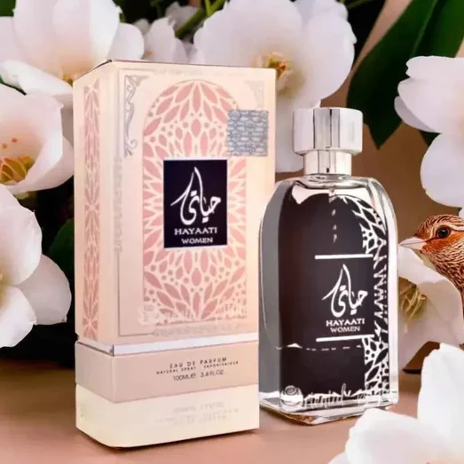 Hayaati perfume bottle and packaging with white flowers in the background