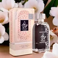 Hayaati perfume bottle and packaging with white flowers in the background