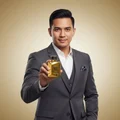 Malaysian man holding Oud 24 Majestic, style confident masculine