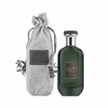 Green perfume bottle with gray drawstring bag on a white background