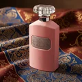 Pink perfume bottle with silver cap on a white background