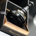 Perfume bottle labeled 'King' in a decorative box with gold accents. King Armaf for men 100ml EDP