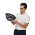 Man holding a black box with 'Connoisseur' branding on a white background