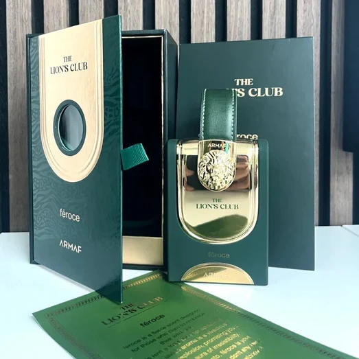 ARMAF The Lion's Club feroce perfume bottle and packaging on a wooden background
