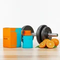 Odyssey Mandarin Sky by Armaf next to dumbbells at gym