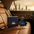 Tres Nuit by Armaf on car back seat at night in KL