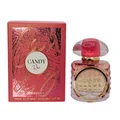 Perfume bottle and packaging of 'Candy Rose' with red roses on a marble surface