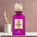 Purple perfume bottle with gold cap on a blurred background