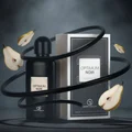 Optimum Noir with floating licorice ribbons and orbiting pear slices in a surreal dark studio; clear bottle and box.