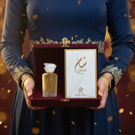 Malaysian woman reveals Sham Perfume Woman — Gulf Orchid bottle and box from a velvet gift; warm spotlight, clear product.