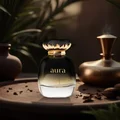 Aura perfume bottle and packaging with lychee fruits on a dark background