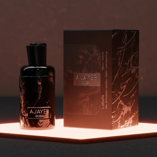 Ajayeb Dubai bottle glowing under TRX’s rose-gold interior lighting