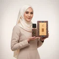 n hijab woman holding ajwad lattafa perfume