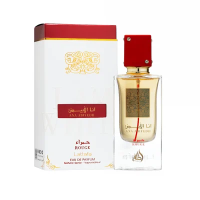 Perfume bottle and packaging with red and gold accents on a white Ana Abiyedh Rouge Lattafa Perfumes for women and men
background