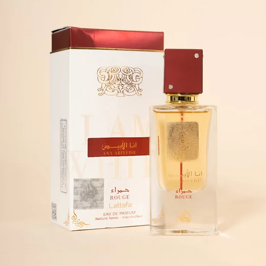 Perfume bottle and packaging with 'Ana Abiviedh' branding on a beige background
