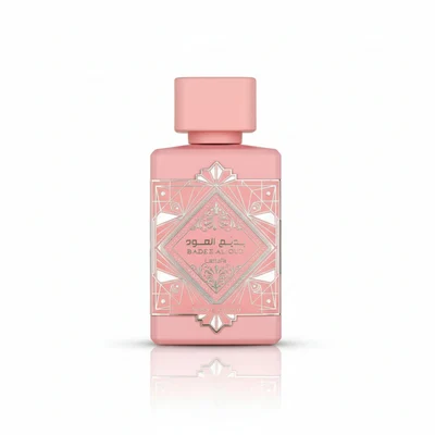 Pink perfume bottle with geometric design on a white background