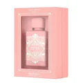 Pink perfume bottle in a matching pink box with 'Noble Blush' text on a white background