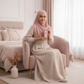 Malaysian hijabi woman in pastel room holding Hayaati Florence soft