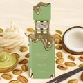 Green perfume bottle with pistachio, coconut, and vanilla beans on a beige background