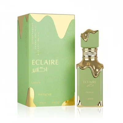 Gold perfume bottle and packaging with floral design on a white background