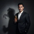 Malay man with horse shadow holding Maahir – men's perfume masculine