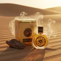 Oud Al Sahraa by Lattafa perfume bottle and box on desert sand with oud wood smoke unisex fragrance