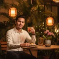 Malay man with Oud Lail Maleki at cafe outdoor – atmosphere evening hangat