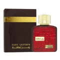 Red perfume bottle with gold cap and black packaging featuring 'Ramz Lattafa' branding on a white background