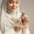 n hijab woman holding Rouat Al Musk, style soft