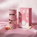 Yara Elixir Lattafa on soft pink satin, luxurious feminine style