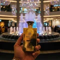 n man holding Brulant Oud at Pavilion KL Center Court