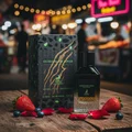 Extravagant Lover at Malaysian night market table with pink‑gold neon reflections, berries and rose petals; clear product.