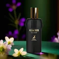 Black perfume bottle labeled 'Glacier Le Noir' with flowers in the background