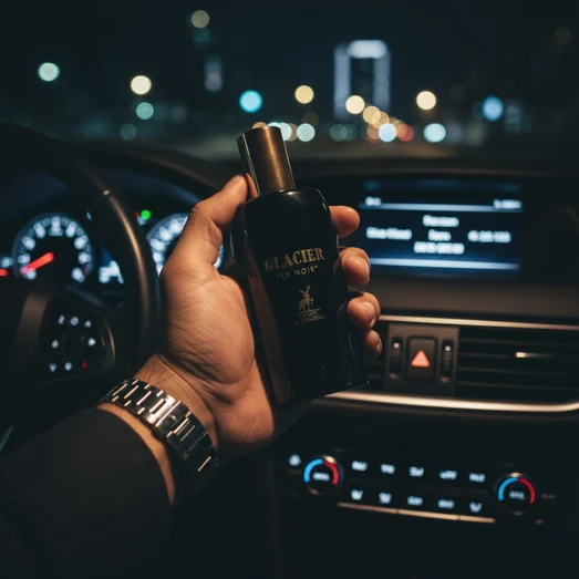 Malay man pegang bottle Glacier Le Noir at dashboard car evening