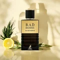 B.A.D Homme eau de parfum bottle with lemon and herbs on a beige background