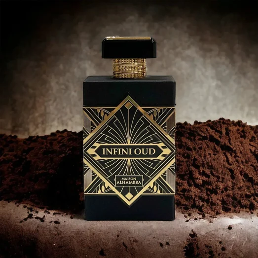 Perfume bottle labeled 'Infini Oud' with gold accents on a textured brown background