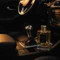 Kismet For Men beside gear shift car amber light