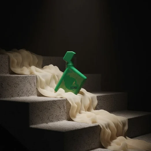Green spray bottle on a staircase with white fabric