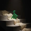 Green spray bottle on a staircase with white fabric