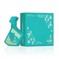 Turquoise perfume bottle and packaging with 'LUXE' branding on a white background