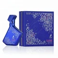 Blue perfume bottle and packaging with 'LUXE NIGHTLIFE' text on a white background