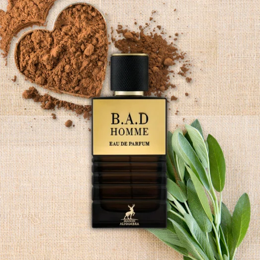B.A.D Homme eau de parfum bottle with cocoa powder and leaves on a textured background