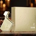 Luxe Gold perfume bottle and packaging on a dark background