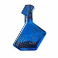 Blue perfume bottle with 'Luxe Journey' text on a white background