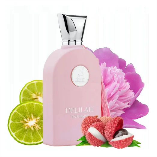 Pink perfume bottle with silver cap, surrounded by a lime, lychee fruit, and pink flower on a white background Delilah Maison Alhambra for women