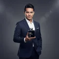 Malaysian man holding Man Black Edition, style masculine elegant